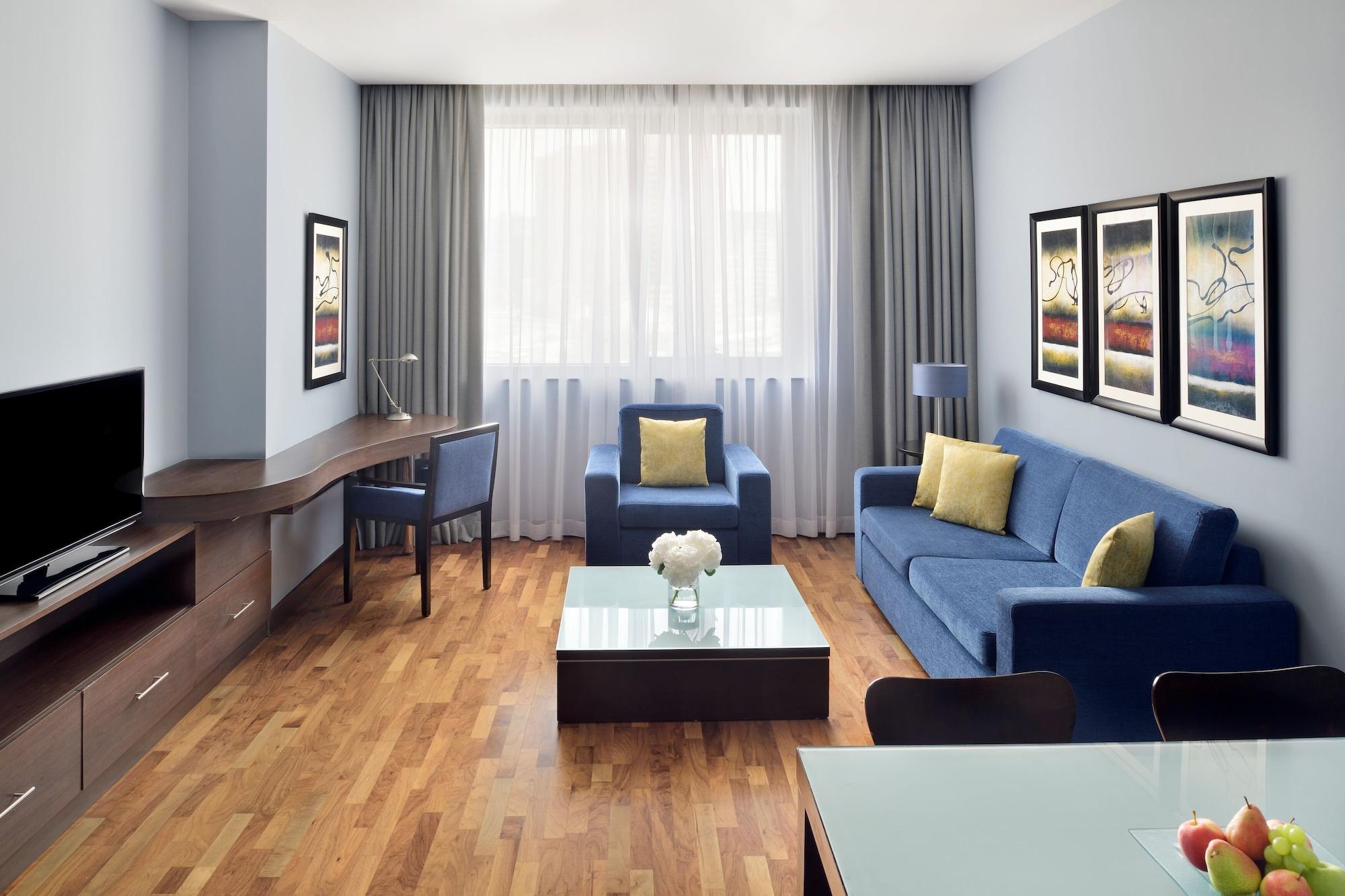 Moevenpick Hotel Apartments Al Mamzar Dubai Ngoại thất bức ảnh A typical living room