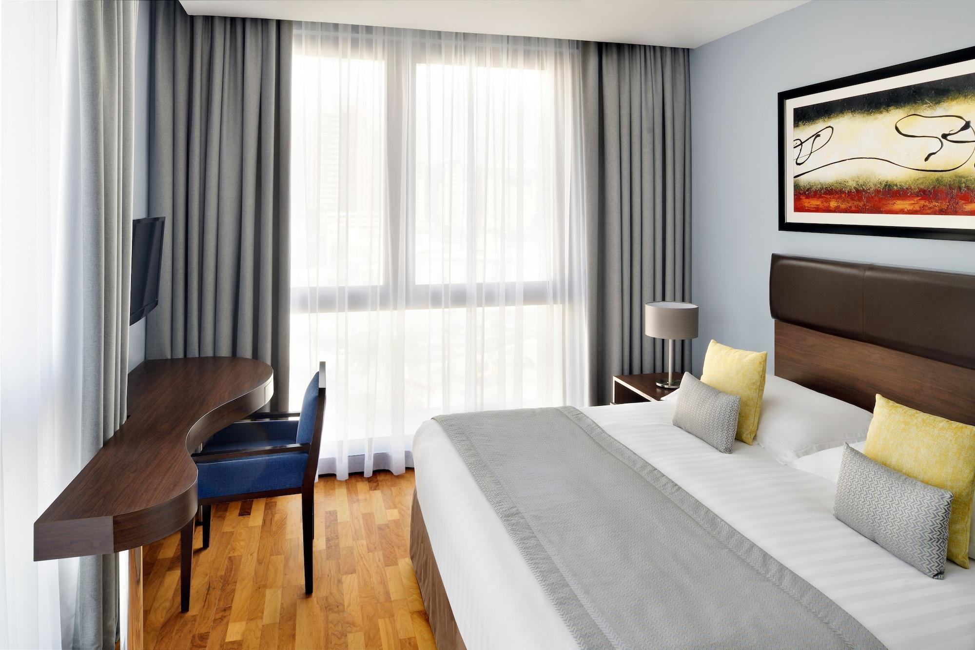 Moevenpick Hotel Apartments Al Mamzar Dubai Ngoại thất bức ảnh A typical room at the hotel