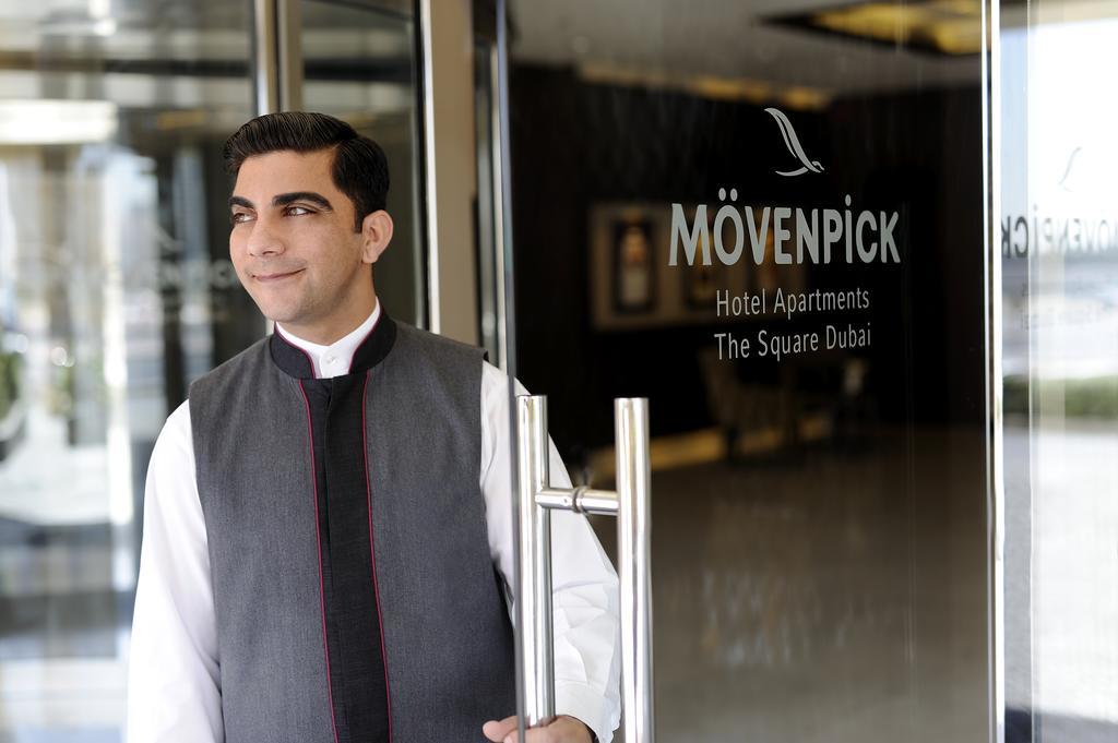 Moevenpick Hotel Apartments Al Mamzar Dubai Ngoại thất bức ảnh A doorman at a hotel in Dubai